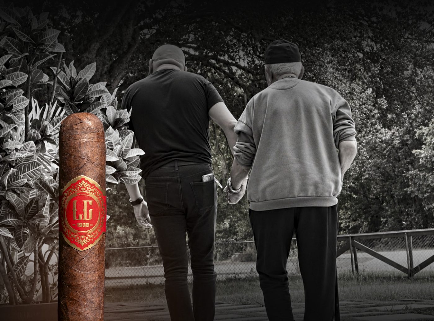 An LC 1938 cigar beside a black-and-white photograph of Luis Cuao walking arm in arm with his father.